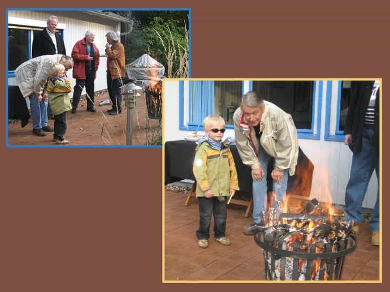 Christian mit Enkel am Feuer Christian mit Enkel am Feuer